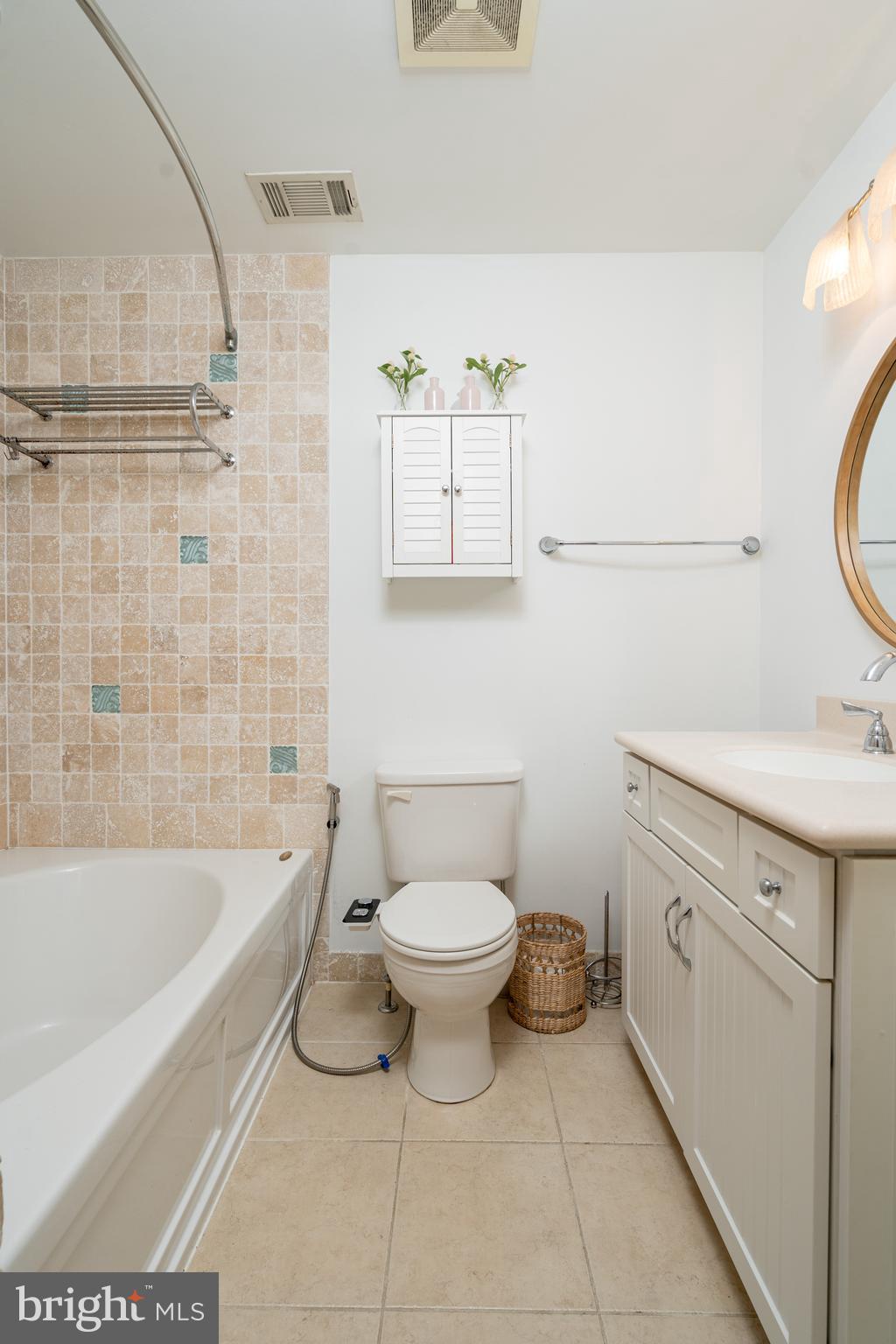 6401 Winnepeg Road Bethesda, MD 20817 - Photo 23 of 41 a bathroom with a sink a toilet and bathtub