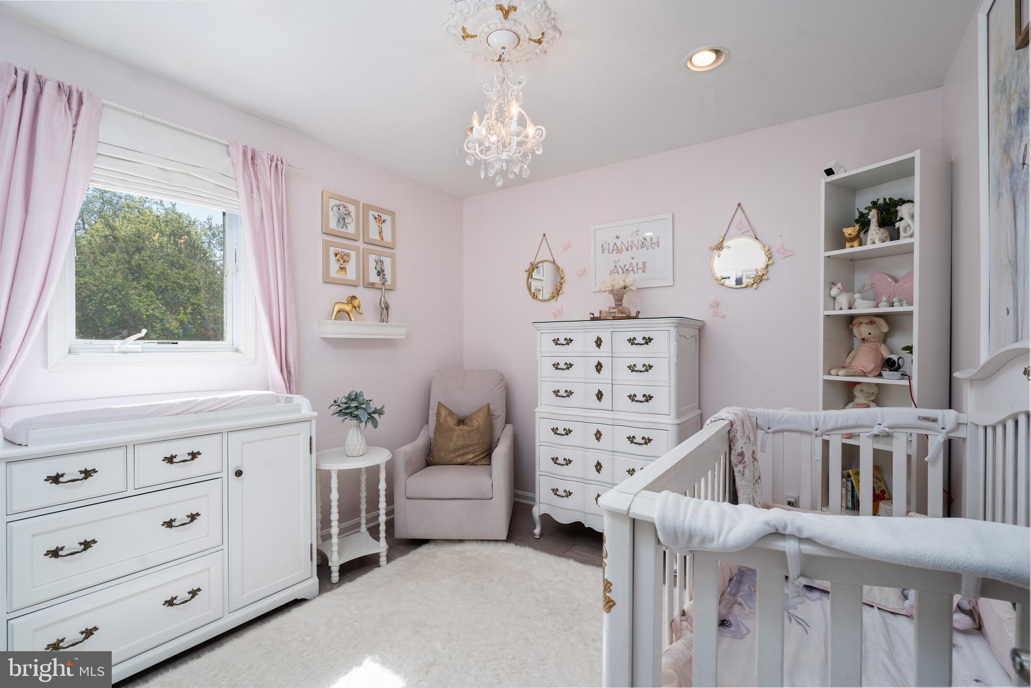 6401 Winnepeg Road Bethesda, MD 20817 - Photo 24 of 41 a bedroom with furniture and a large window