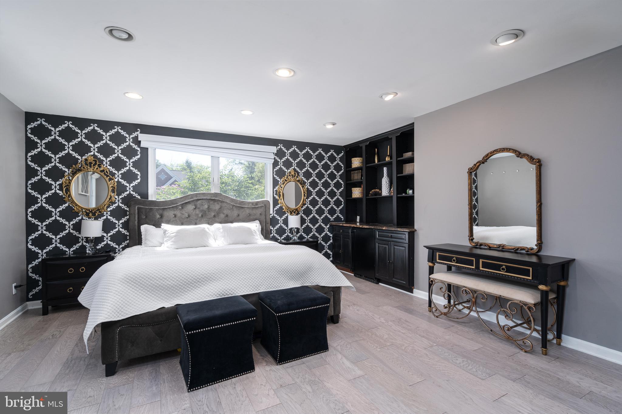 6401 Winnepeg Road Bethesda, MD 20817 - Photo 26 of 41 a bedroom with a bed table and chair