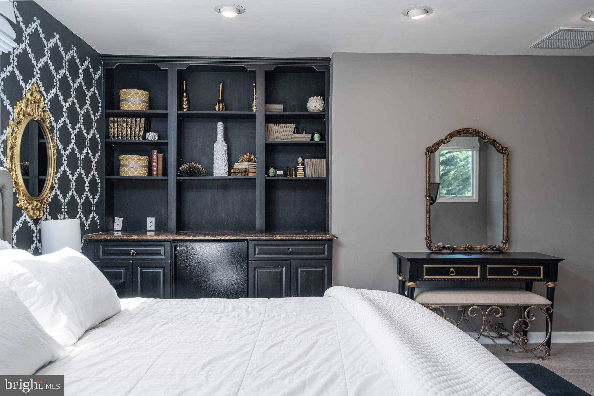 6401 Winnepeg Road Bethesda, MD 20817 - Photo 27 of 41 a bedroom with a bed and a television