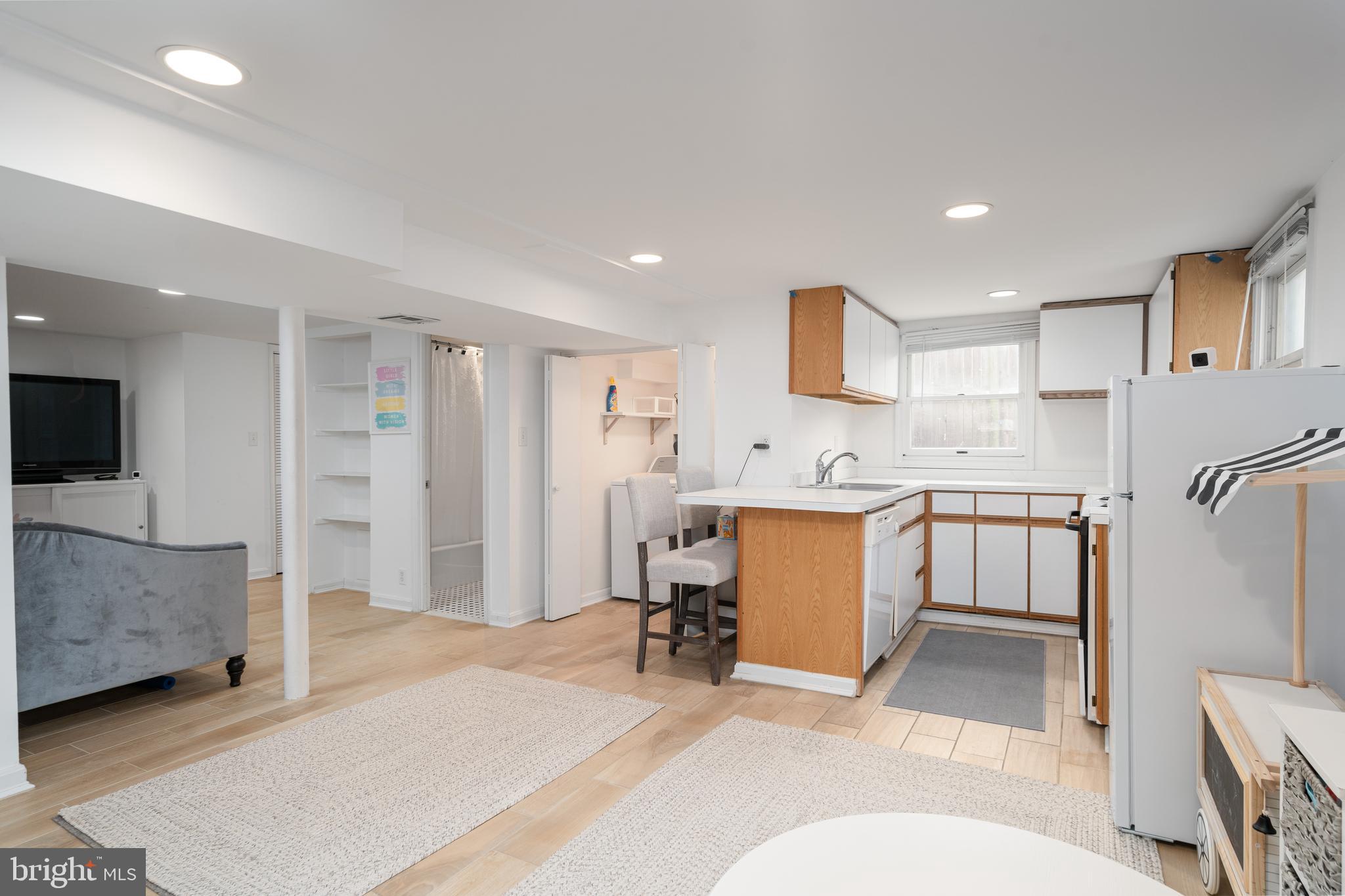6401 Winnepeg Road Bethesda, MD 20817 - Photo 32 of 41 a view of a kitchen with a sink and a living room