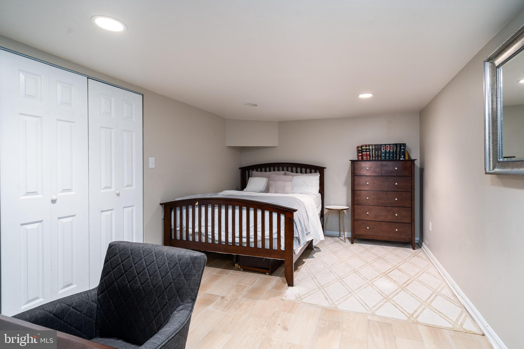 6401 Winnepeg Road Bethesda, MD 20817 - Photo 35 of 41 a bedroom with a bed and a chair