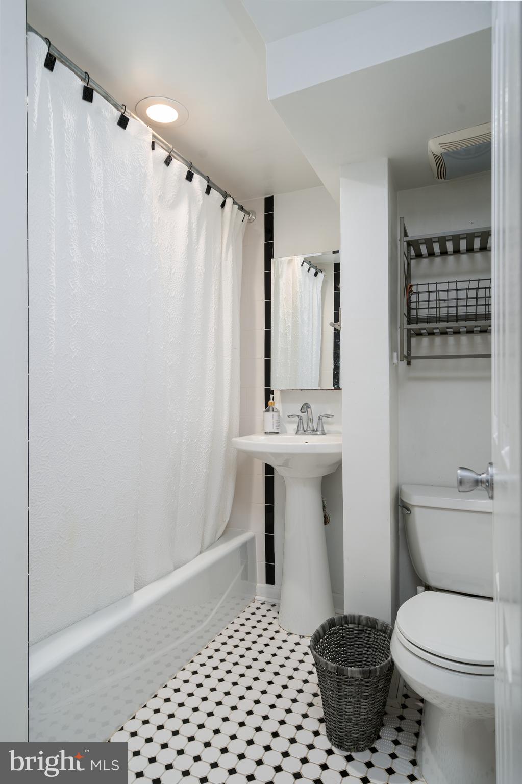 6401 Winnepeg Road Bethesda, MD 20817 - Photo 36 of 41 a bathroom with a sink toilet and shower