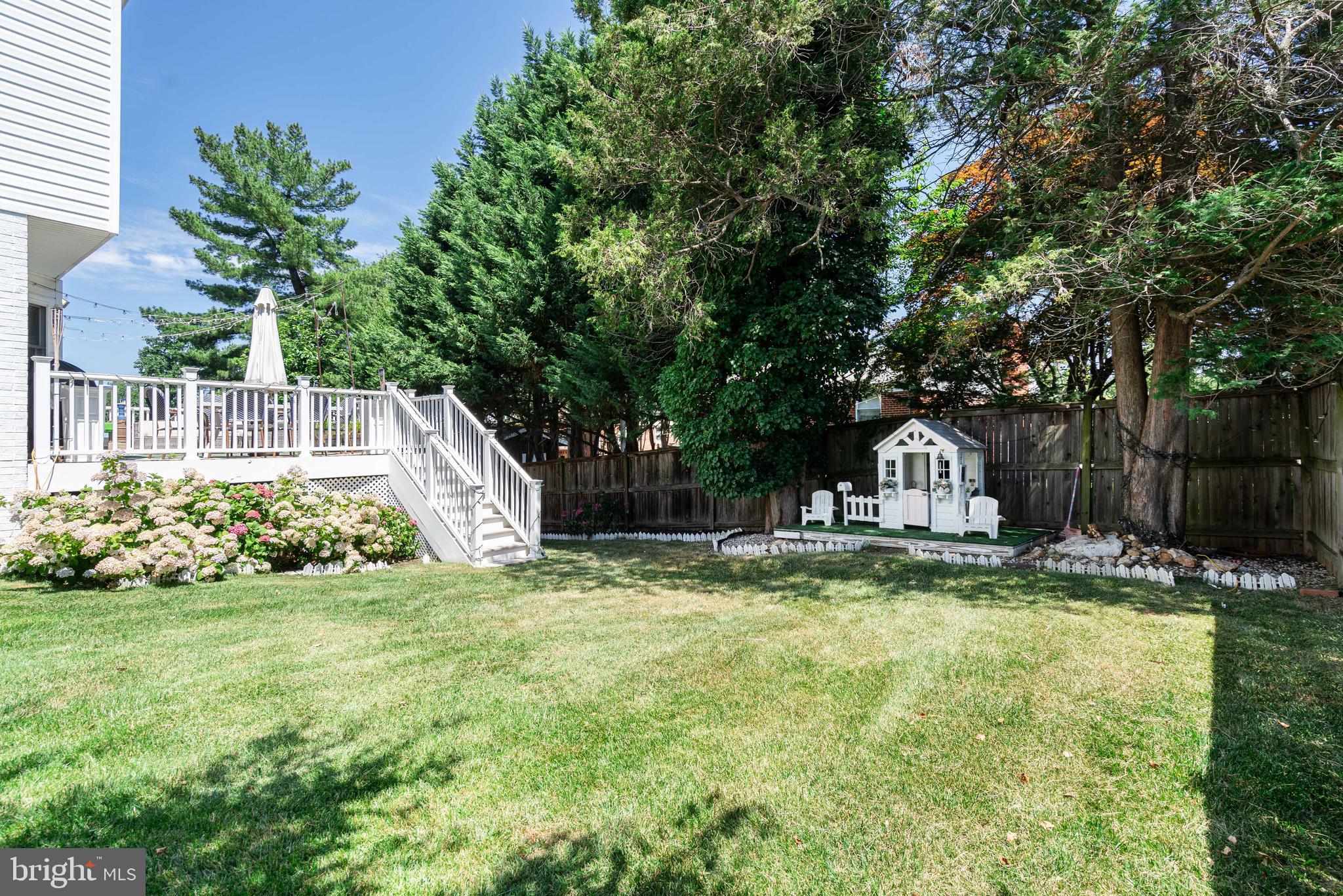 6401 Winnepeg Road Bethesda, MD 20817 - Photo 37 of 41 a view of a house with a yard and sitting area