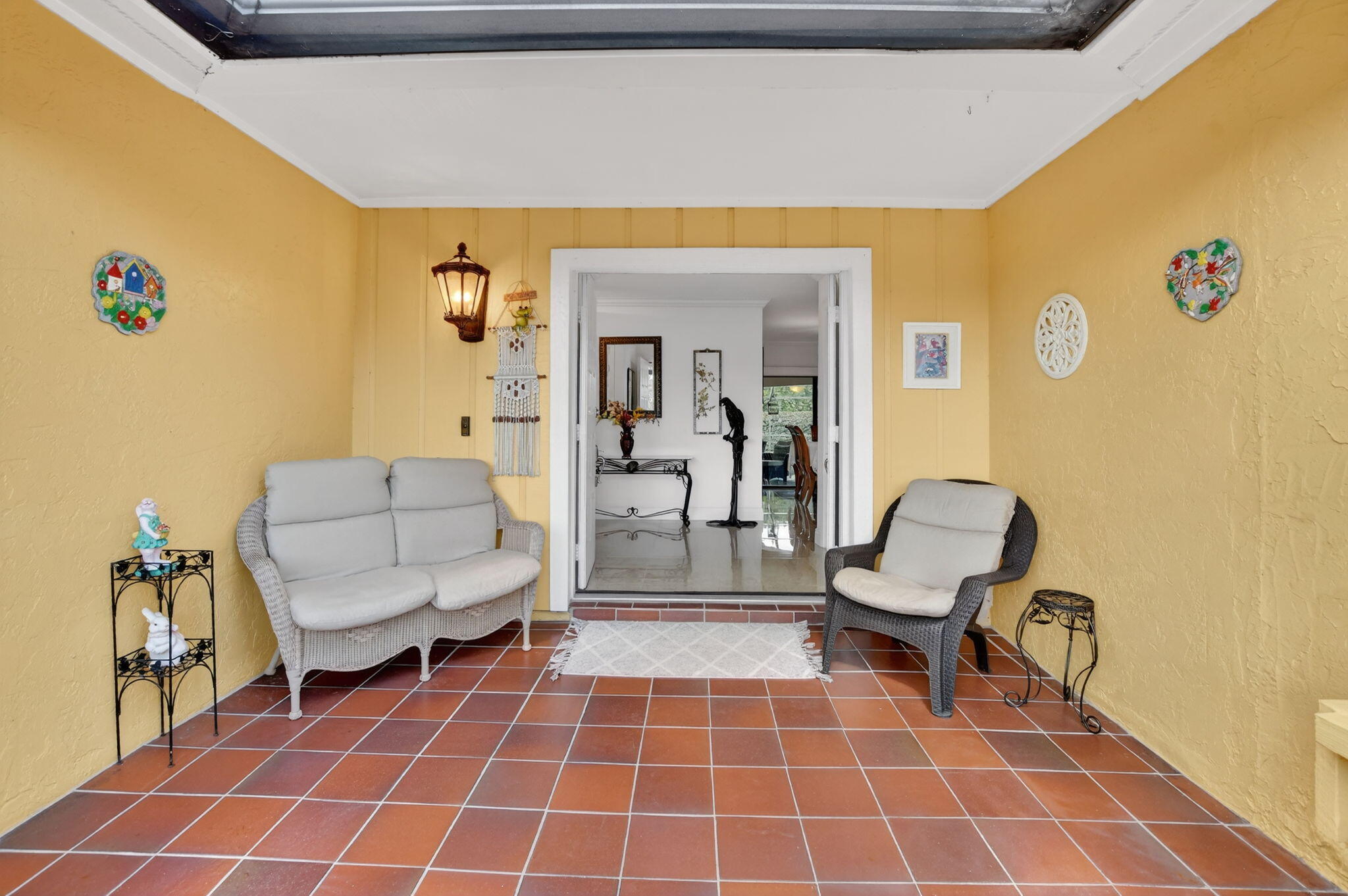 4205 Birchwood Drive Boca Raton, FL 33487 - Photo 12 of 75 a living room with couches and a dining table with painted walls