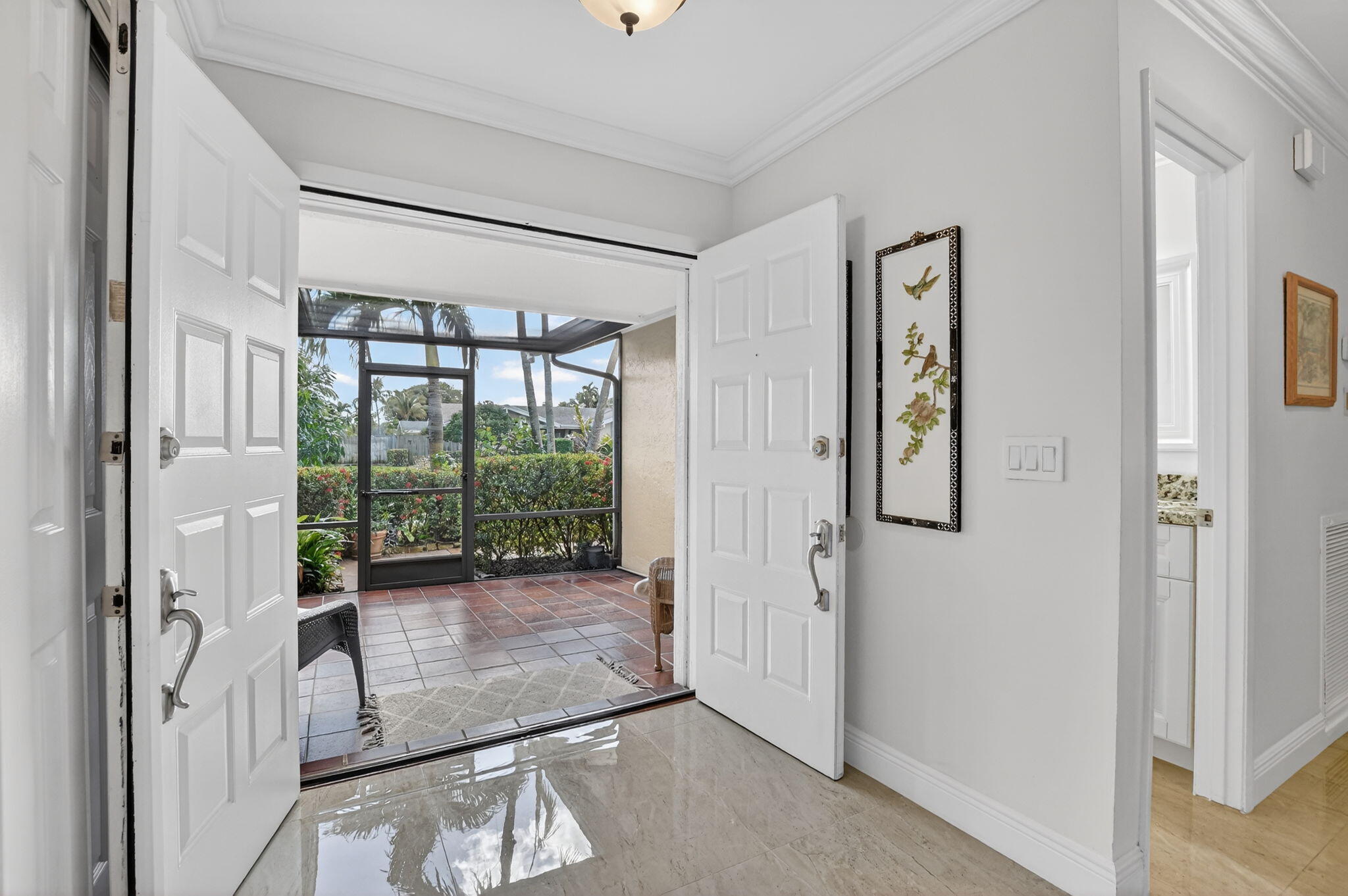 4205 Birchwood Drive Boca Raton, FL 33487 - Photo 13 of 75 a view of entryway with floor to ceiling window
