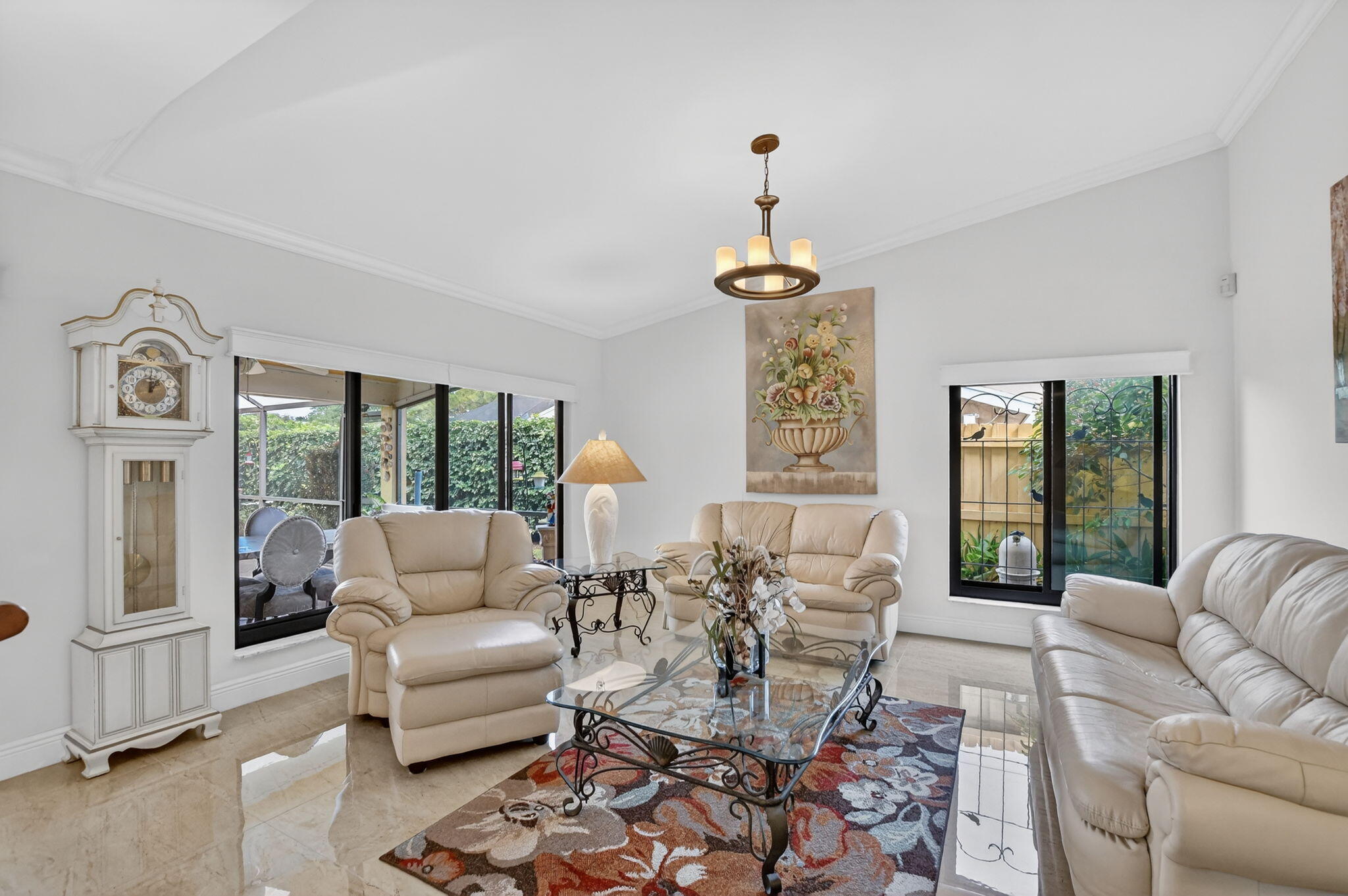 4205 Birchwood Drive Boca Raton, FL 33487 - Photo 17 of 75 a living room with furniture and a large window