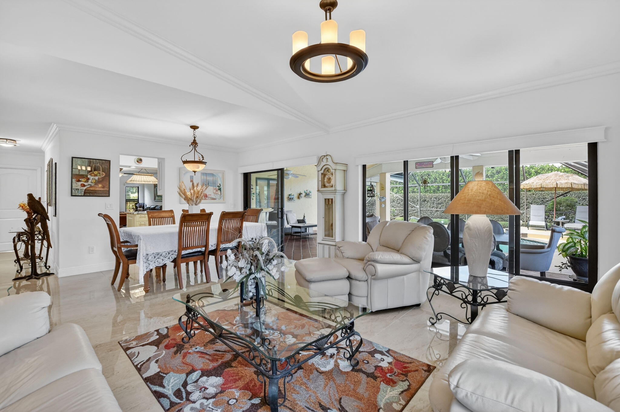 4205 Birchwood Drive Boca Raton, FL 33487 - Photo 18 of 75 a living room with furniture kitchen view and a large window