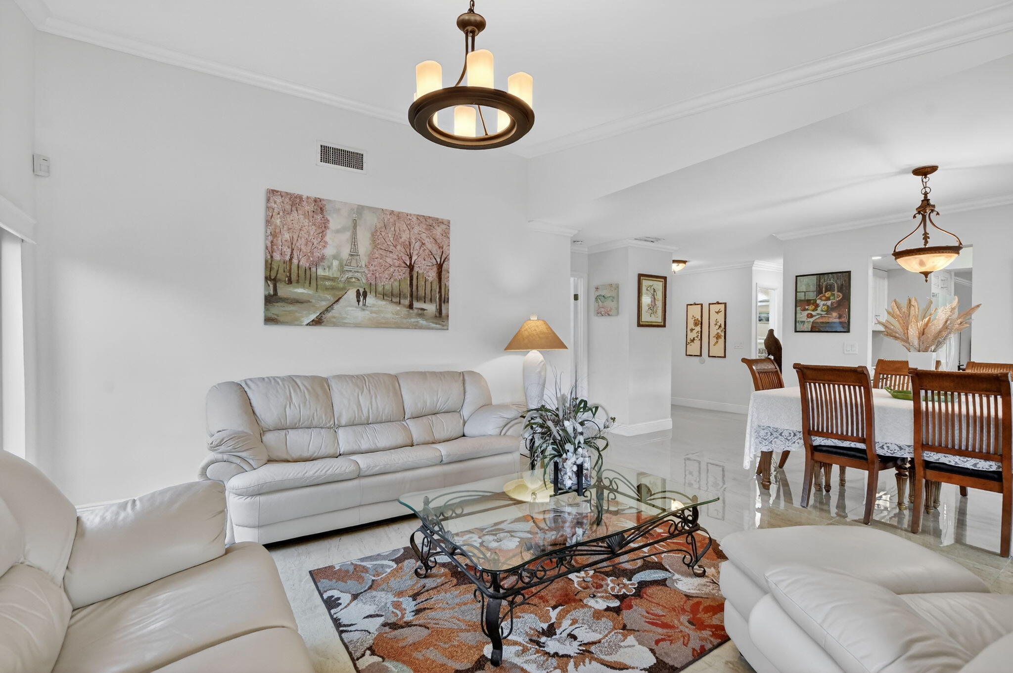 4205 Birchwood Drive Boca Raton, FL 33487 - Photo 19 of 75 a living room with furniture kitchen view and a wooden floor