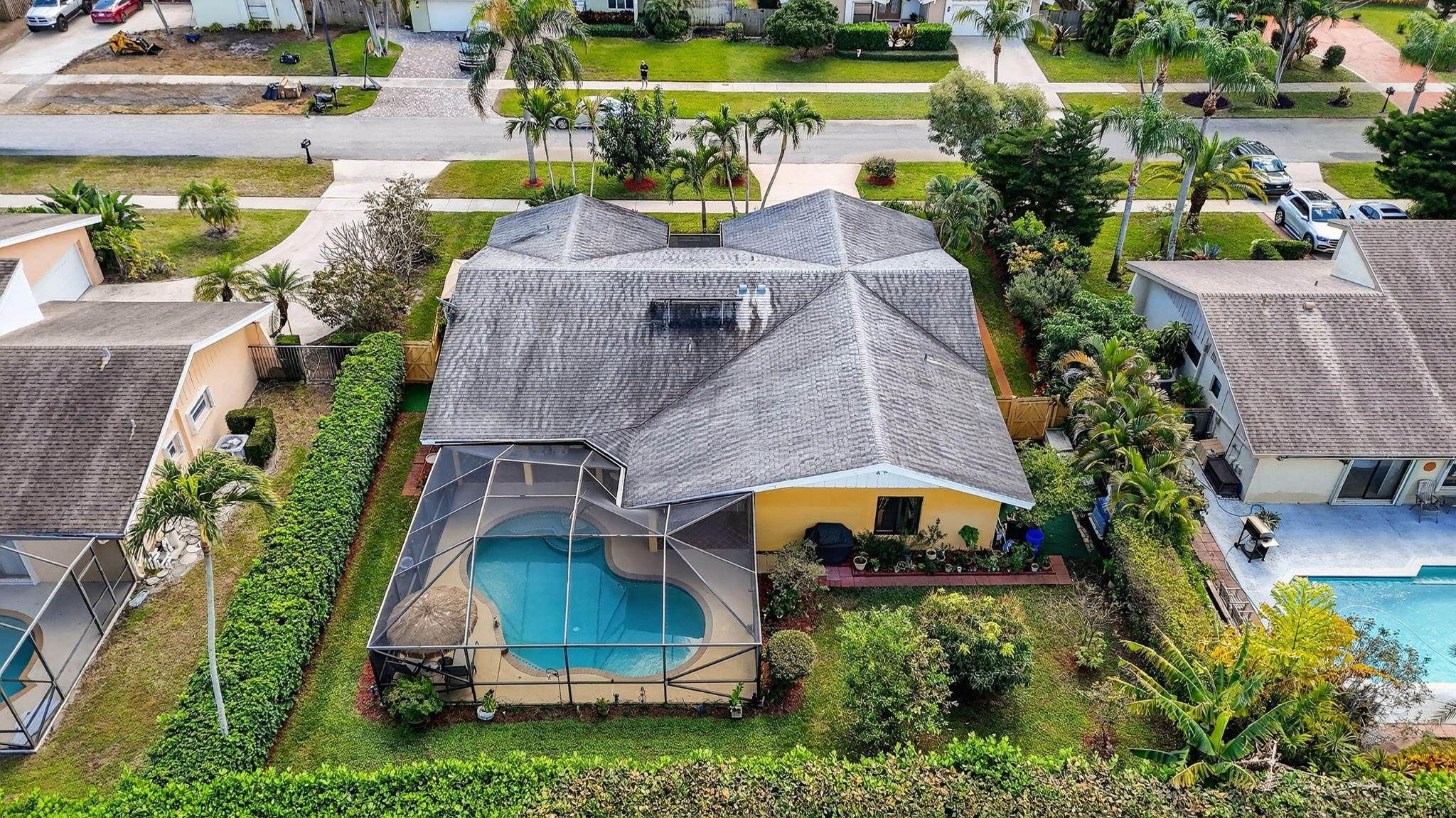 4205 Birchwood Drive Boca Raton, FL 33487 - Photo 2 of 75 an aerial view of a house with a garden