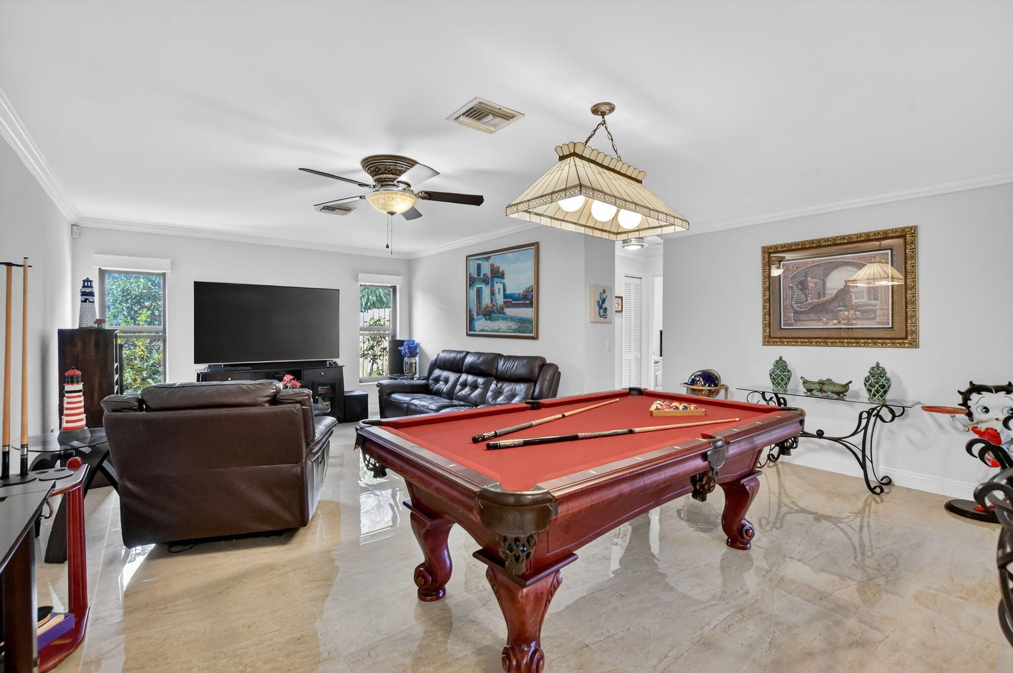 4205 Birchwood Drive Boca Raton, FL 33487 - Photo 27 of 75 a living room with furniture and a flat screen tv