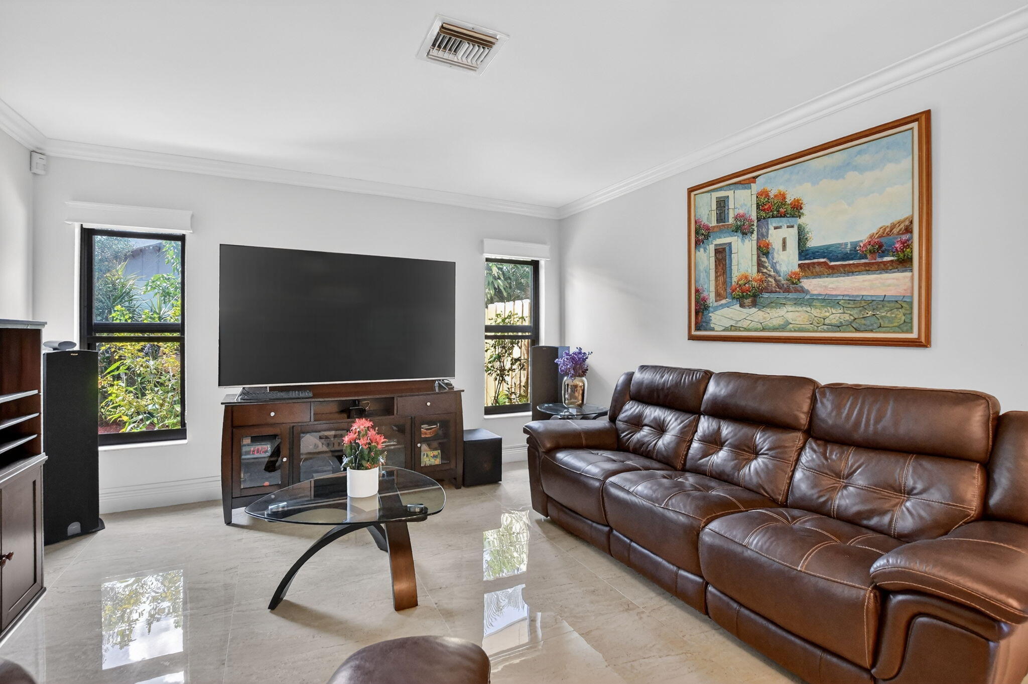 4205 Birchwood Drive Boca Raton, FL 33487 - Photo 30 of 75 a living room with furniture workspace and a flat screen tv