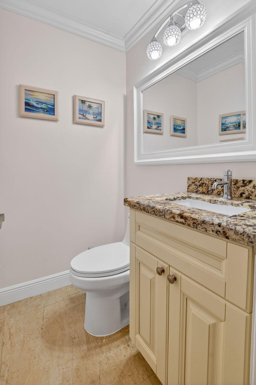 4205 Birchwood Drive Boca Raton, FL 33487 - Photo 42 of 75 a bathroom with a toilet a sink and a mirror