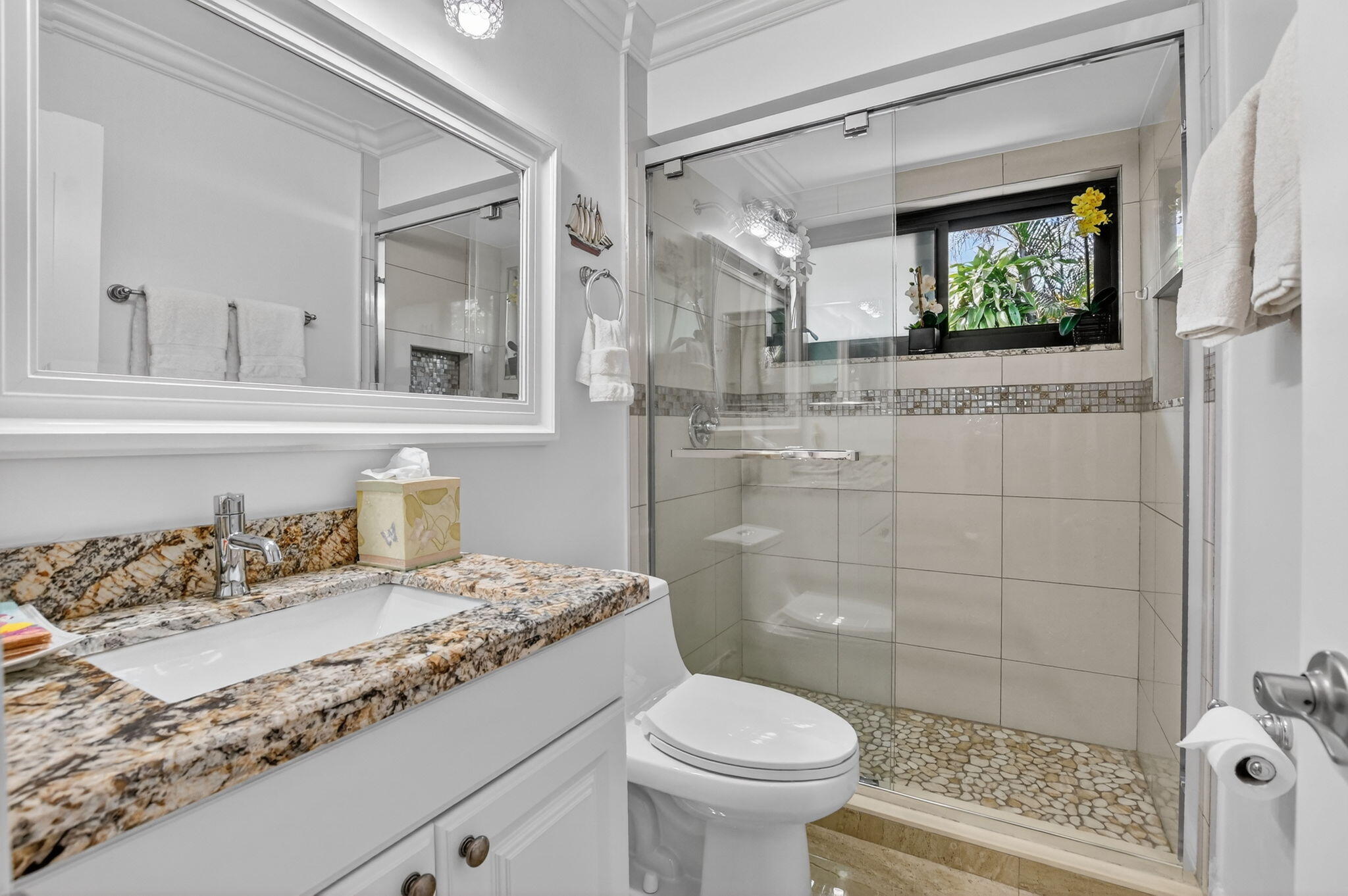 4205 Birchwood Drive Boca Raton, FL 33487 - Photo 45 of 75 a bathroom with a granite countertop sink mirror vanity and toilet