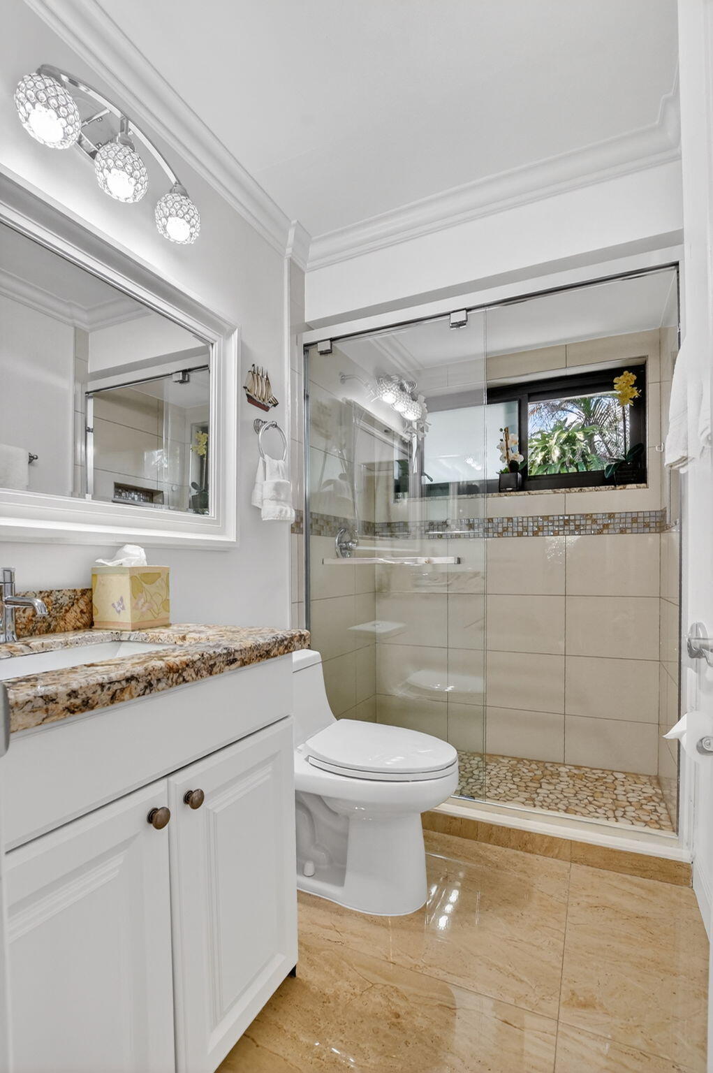 4205 Birchwood Drive Boca Raton, FL 33487 - Photo 46 of 75 a bathroom with a granite countertop sink mirror vanity and toilet