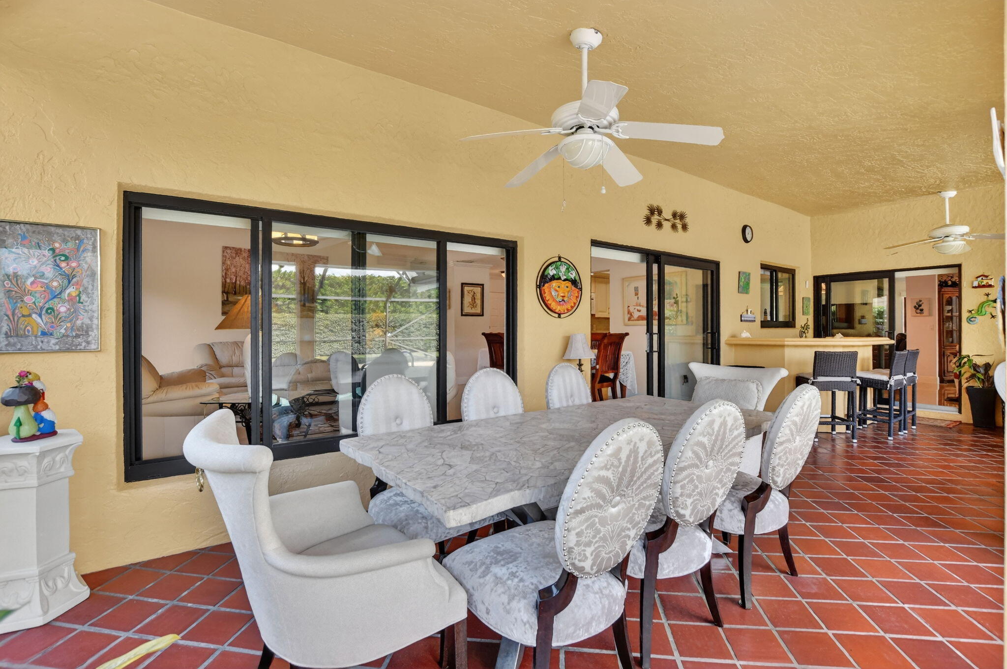 4205 Birchwood Drive Boca Raton, FL 33487 - Photo 53 of 75 a view of a dining room with furniture