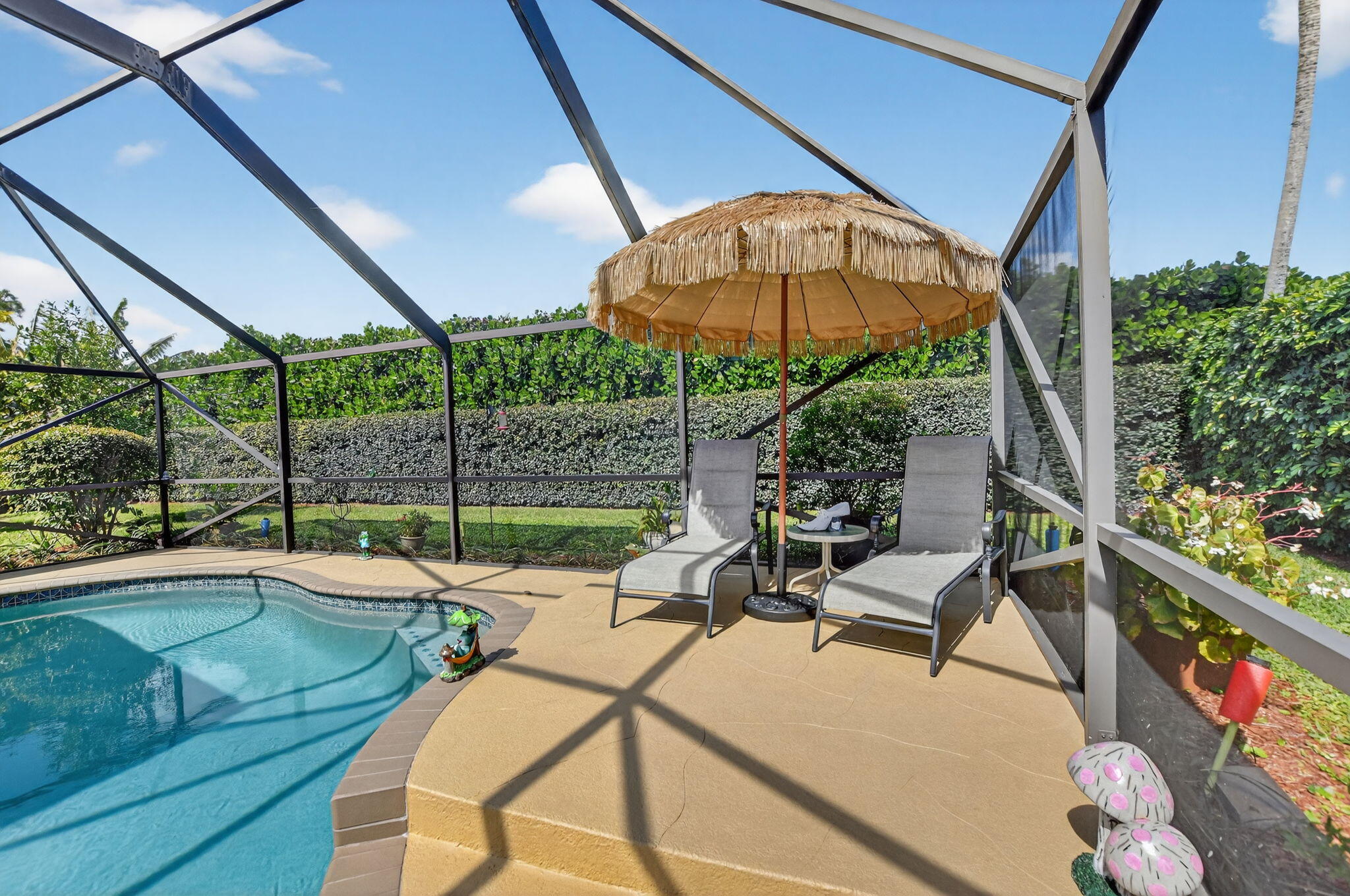 4205 Birchwood Drive Boca Raton, FL 33487 - Photo 54 of 75 a view of a backyard with a patio and a garden