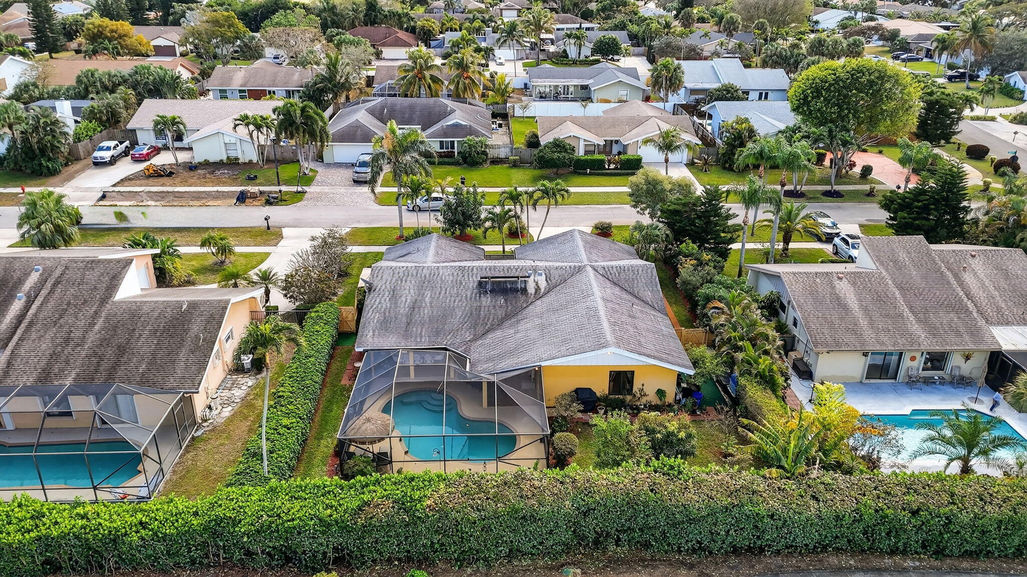4205 Birchwood Drive Boca Raton, FL 33487 - Photo 70 of 75 an aerial view of multiple houses with yard