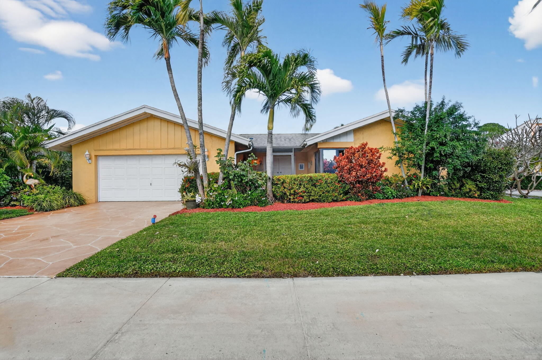 4205 Birchwood Drive Boca Raton, FL 33487 - Photo 7 of 75 a front view of house with yard and green space