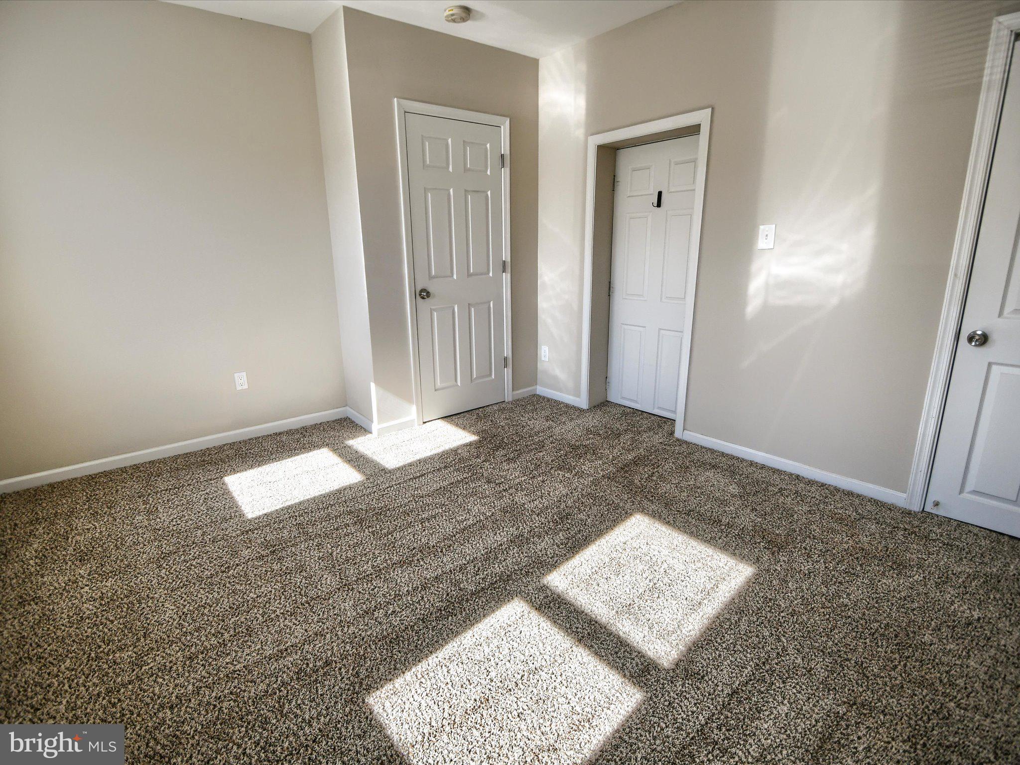 24 West Front Street Bridgeport, PA 19405 - Photo 14 of 32 an empty room with a rug