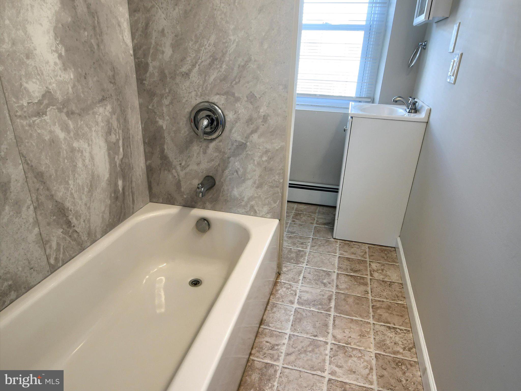 24 West Front Street Bridgeport, PA 19405 - Photo 17 of 32 a bathroom with a bathtub