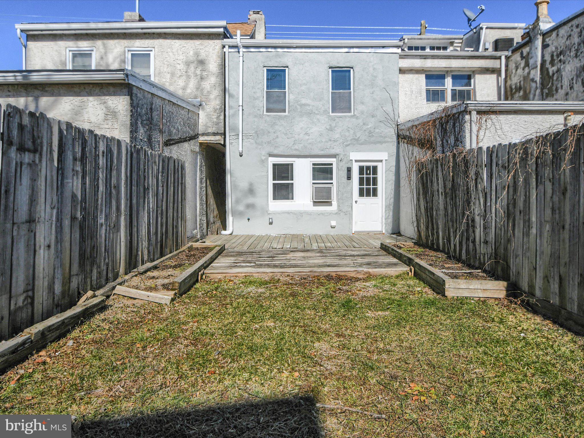 24 West Front Street Bridgeport, PA 19405 - Photo 28 of 32 a view of house with backyard and wooden fence