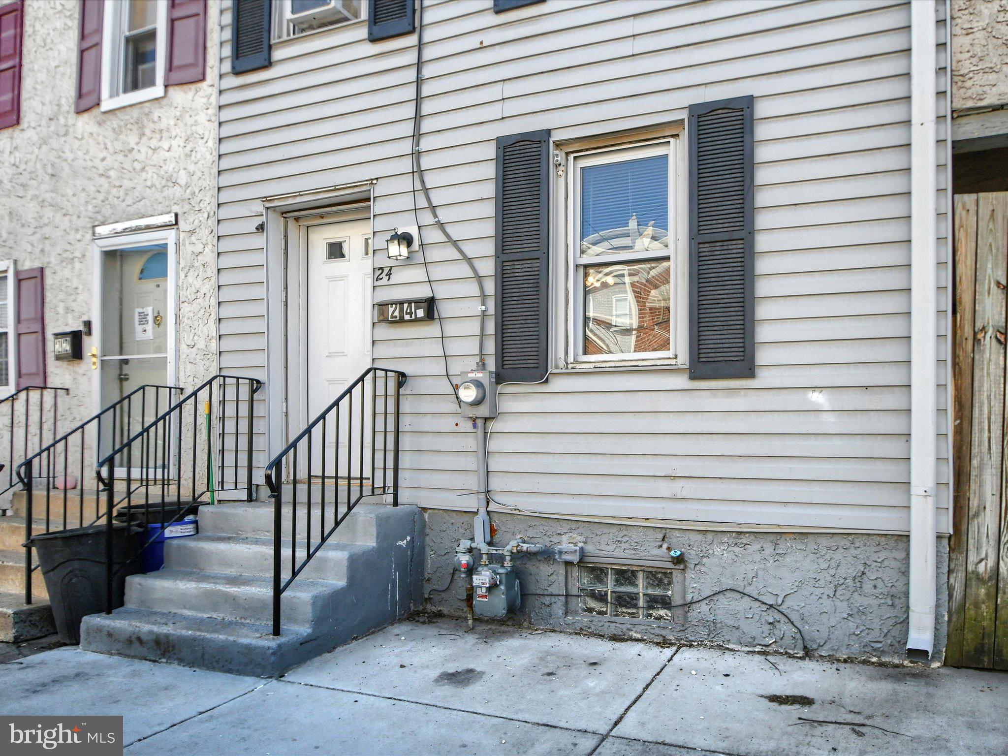 24 West Front Street Bridgeport, PA 19405 - Photo 3 of 32 a view of a house with wooden floor and a large window