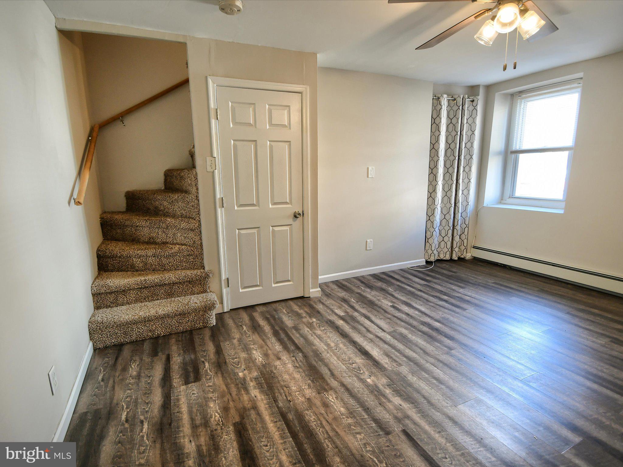 24 West Front Street Bridgeport, PA 19405 - Photo 6 of 32 wooden floor in an empty room with a window