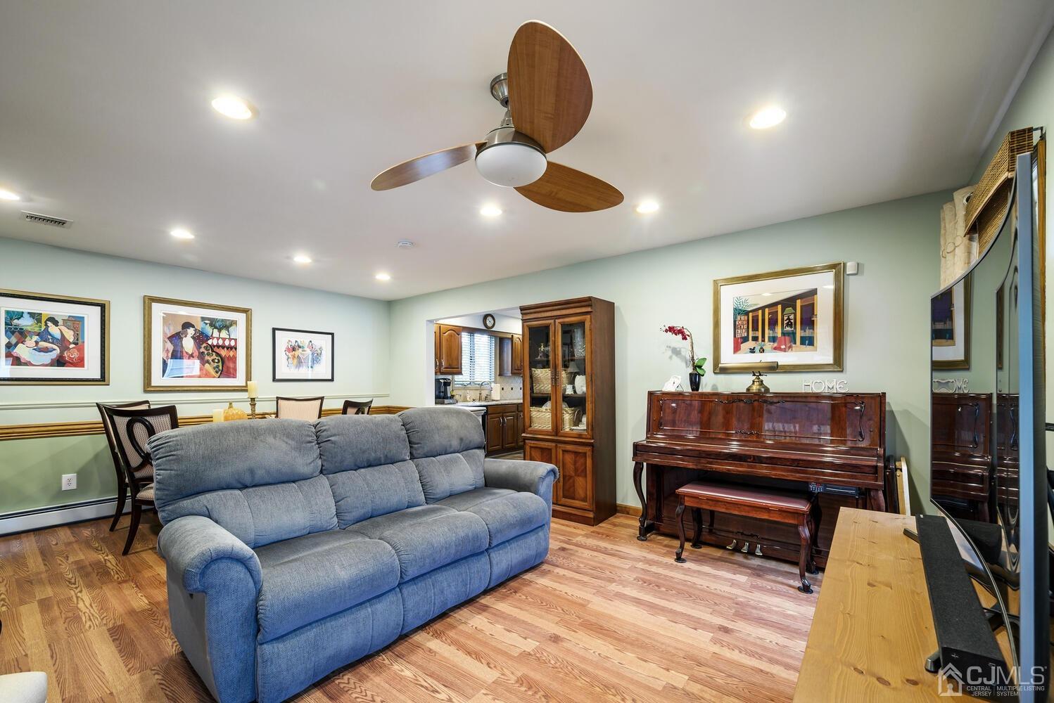 28 Rector Avenue Woodbridge, NJ 07095 - Photo 16 of 32 a living room with furniture ceiling fan and a window