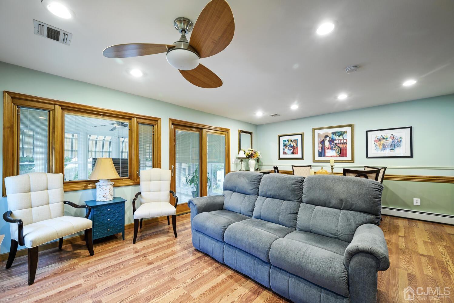 28 Rector Avenue Woodbridge, NJ 07095 - Photo 17 of 32 a living room with furniture ceiling fan and a large window