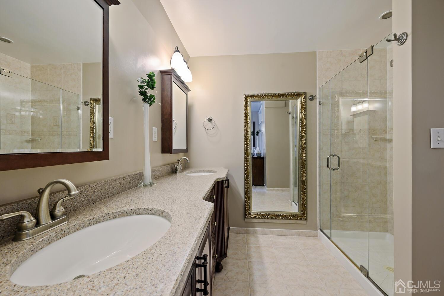 28 Rector Avenue Woodbridge, NJ 07095 - Photo 22 of 32 a bathroom with a sink and a mirror