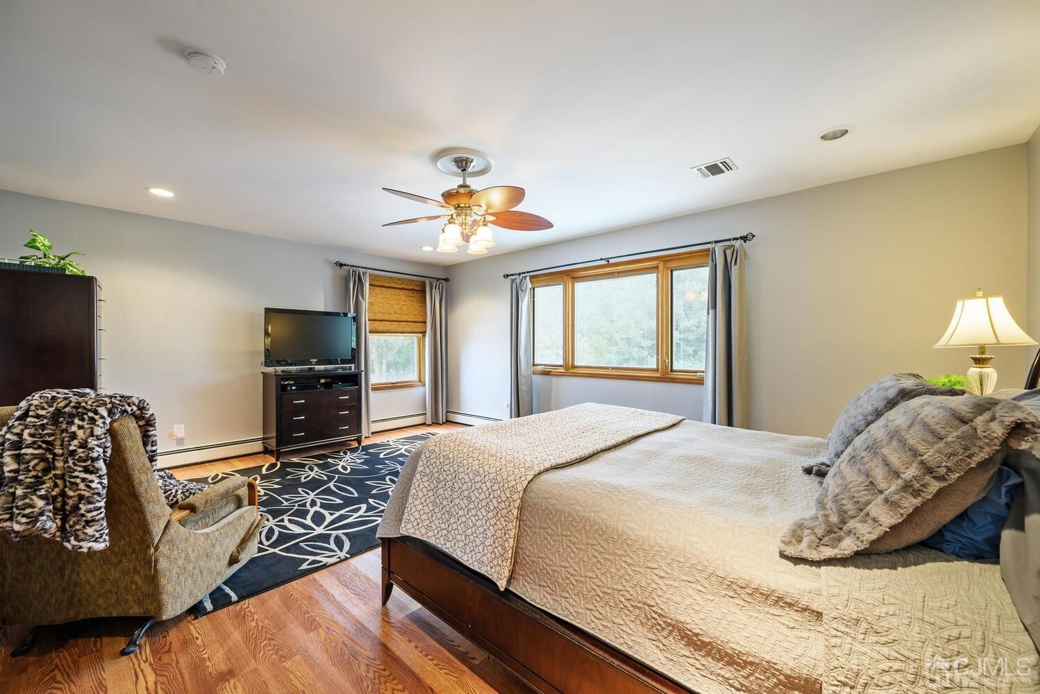 28 Rector Avenue Woodbridge, NJ 07095 - Photo 23 of 32 a bedroom with a bed and a chandelier