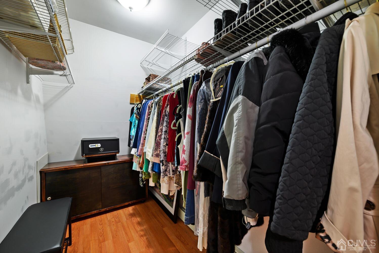 28 Rector Avenue Woodbridge, NJ 07095 - Photo 24 of 32 a view of walk in closet with clothes and shoes