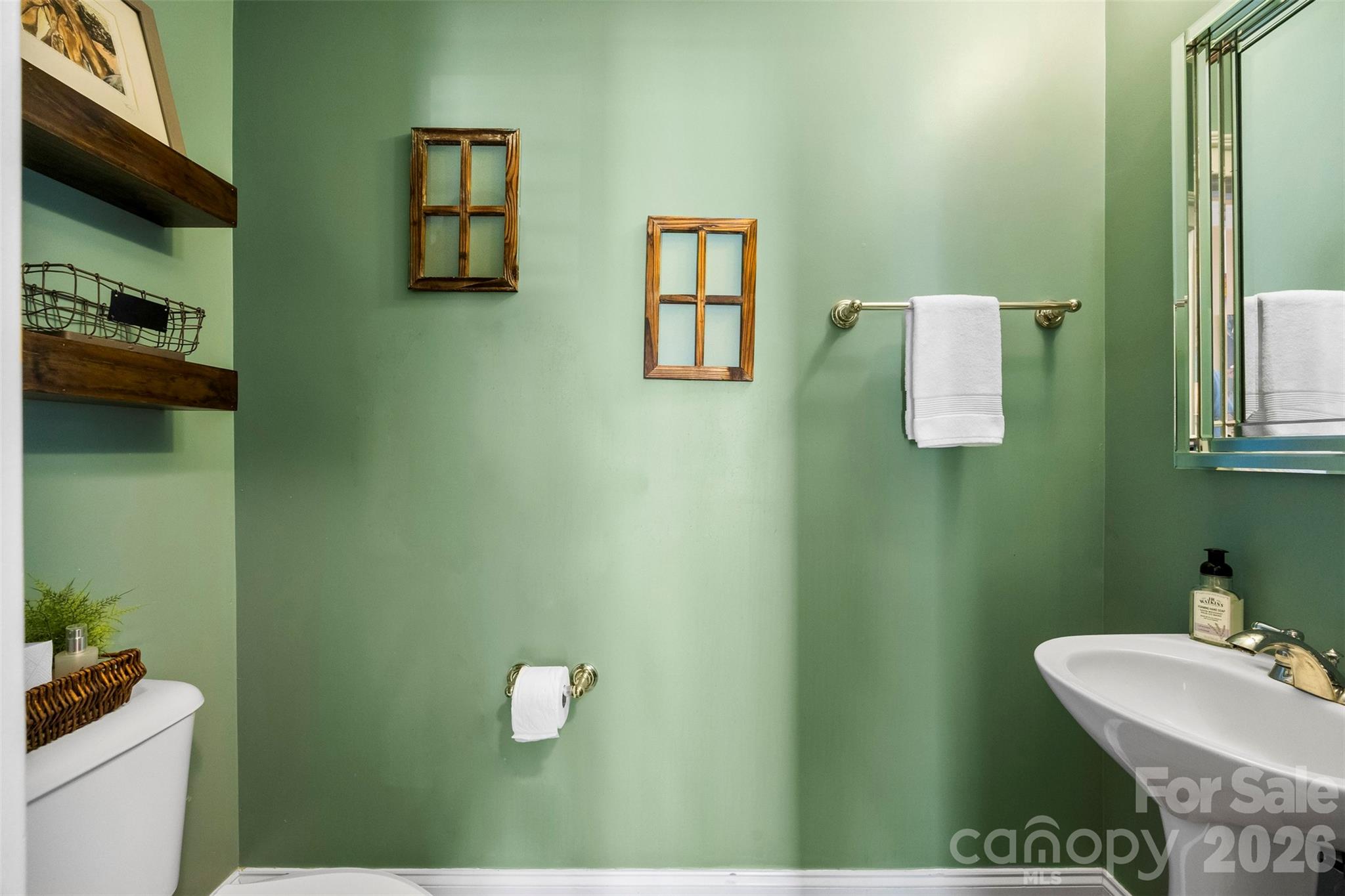 606 Andover Lane Tega Cay, SC 29708 - Photo 18 of 48 a bathroom with a sink and a mirror