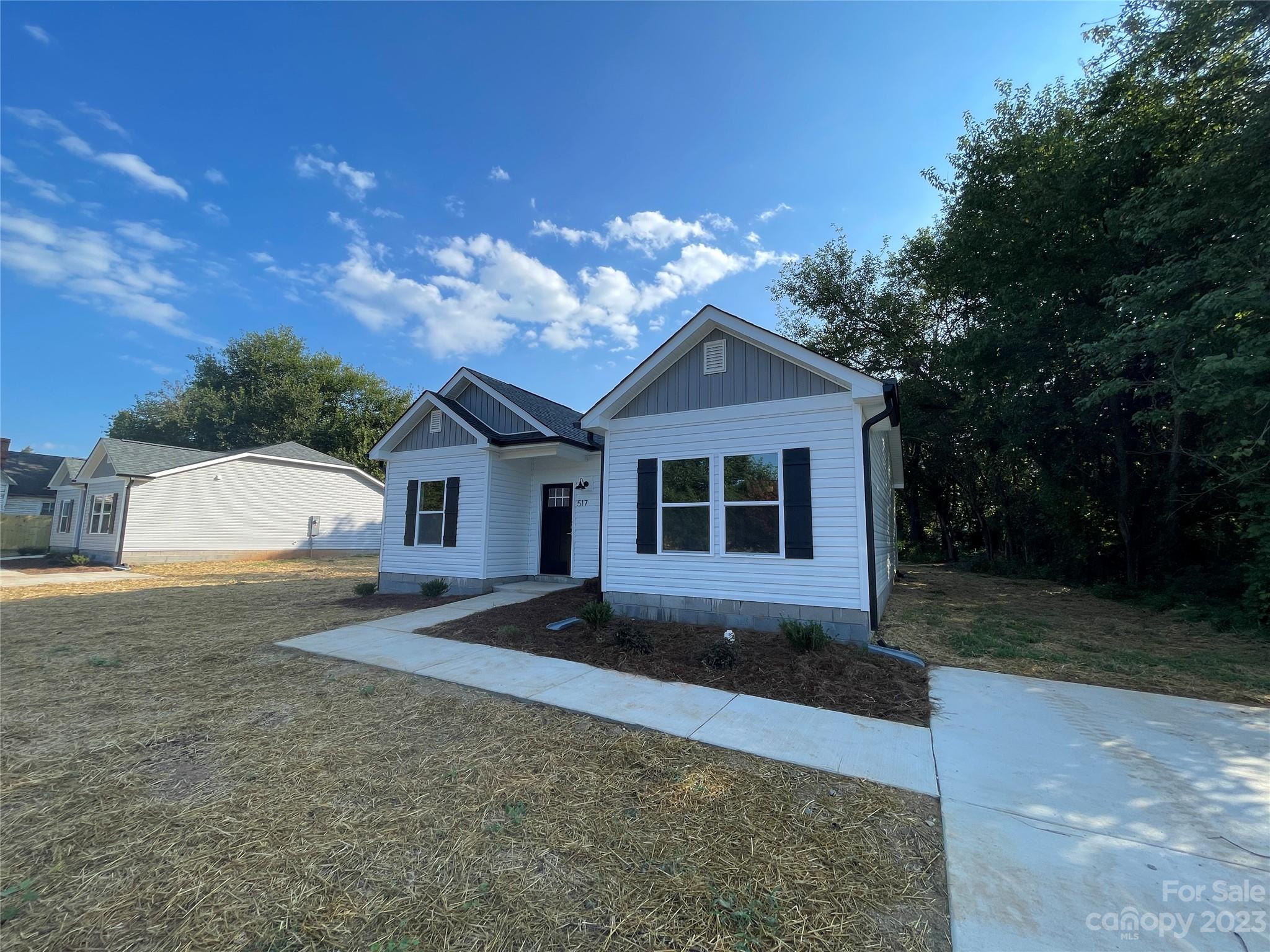 517 Correll Street Salisbury, NC 28144 - Photo 2 of 24 a front view of a house with a yard and garage