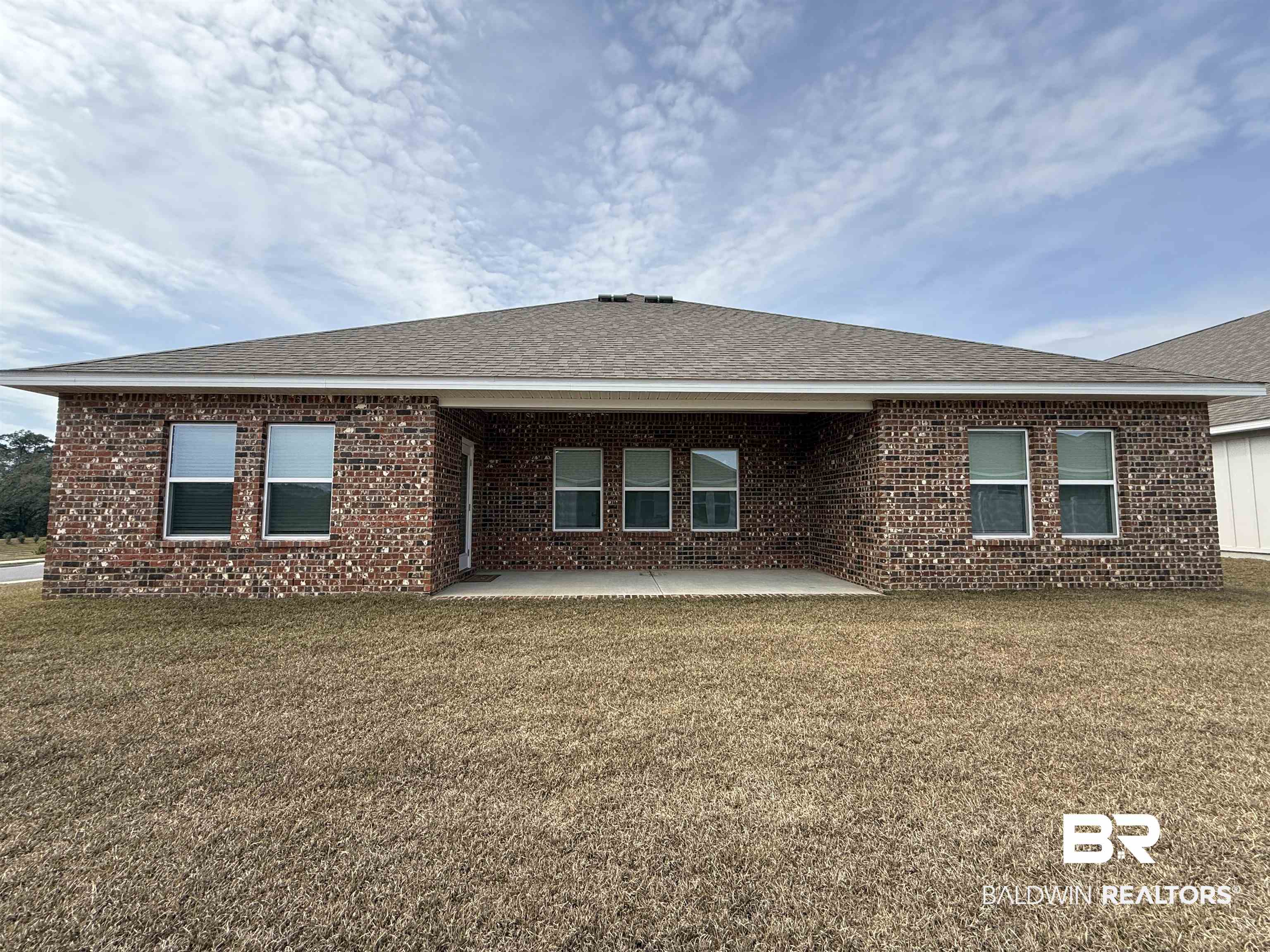 11442 Genuine Risk Circle Daphne, AL 36526 - Photo 21 of 21 Back of house featuring a patio area, a lawn, brick siding, and roof with shingles