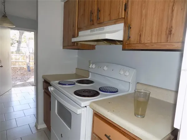 a kitchen with a stove and a sink