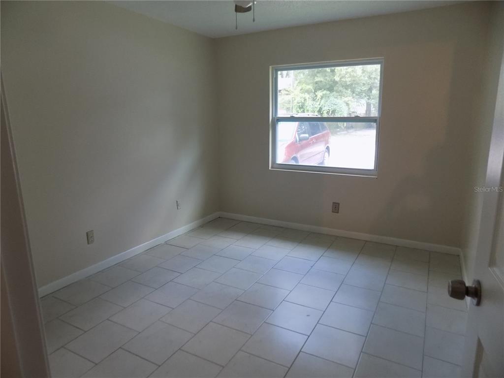 6124 Southwest 10th Place Gainesville, FL 32607 - Photo 5 of 6 an empty room with a window