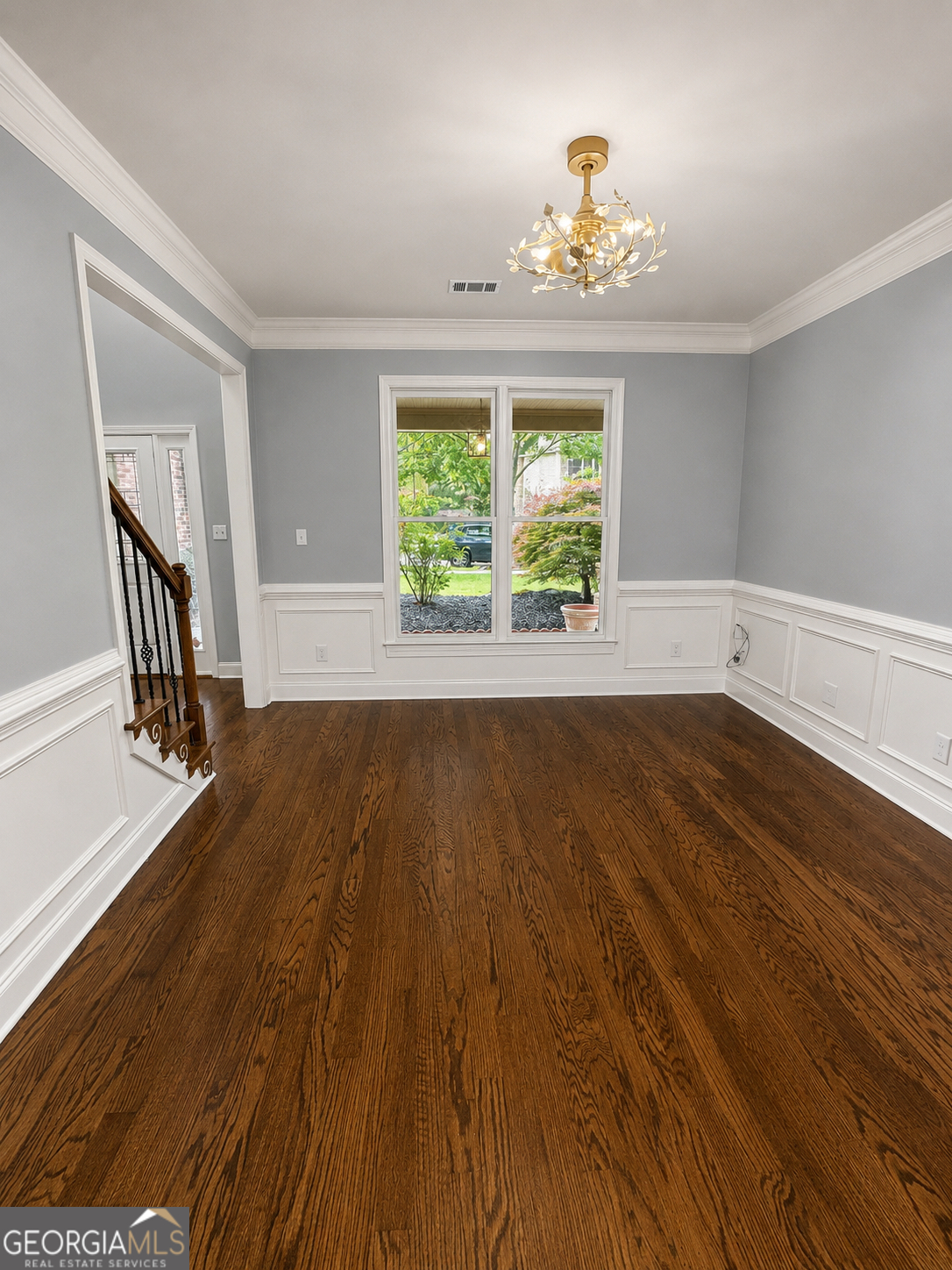 2614 Dolostone Way Dacula, GA 30019 - Photo 9 of 29 wooden floor in an empty room with a window