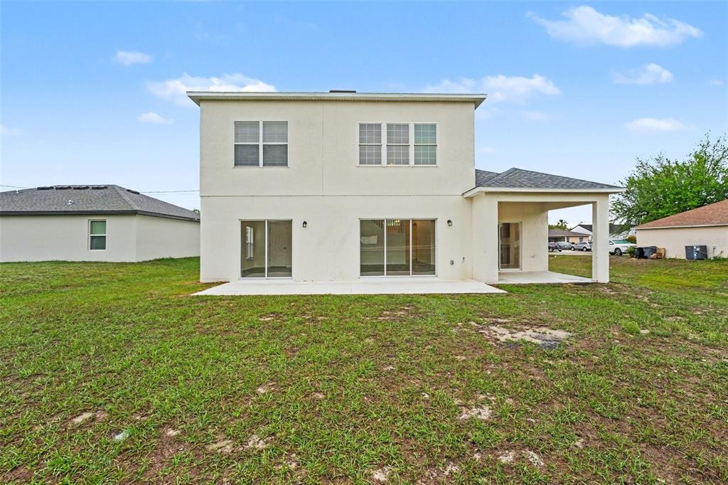 320 Snook Way Kissimmee, FL 34759 - Photo 15 of 15 a front view of a house with a garden