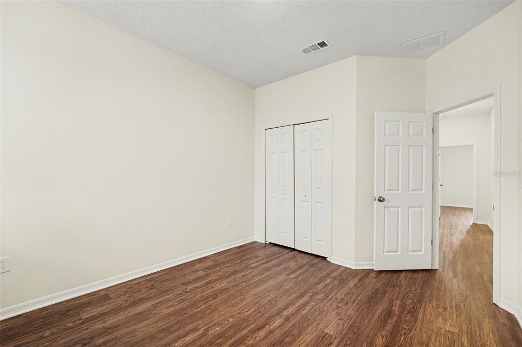 320 Snook Way Kissimmee, FL 34759 - Photo 10 of 15 a view of a room with wooden floor and white wall