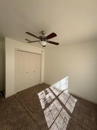 a room with a closet and a walk in closet