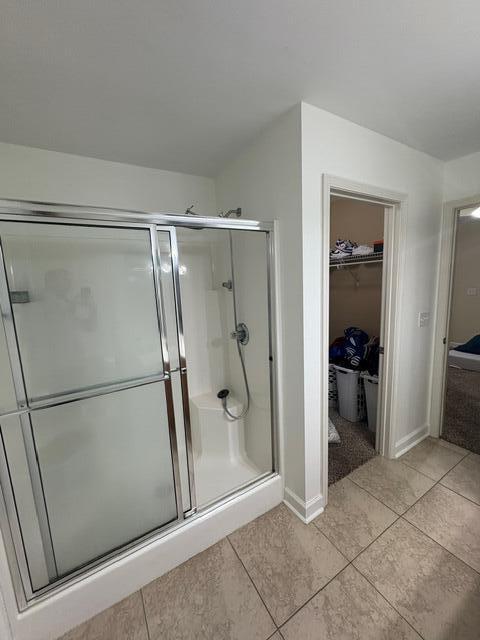 3157 Forrest Avenue Crestview, FL 32539 - Photo 16 of 22 a bathroom with a glass shower door and a sink