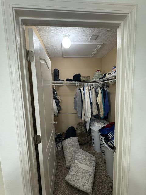 3157 Forrest Avenue Crestview, FL 32539 - Photo 17 of 22 a view of walk in closet with clothes and shoes