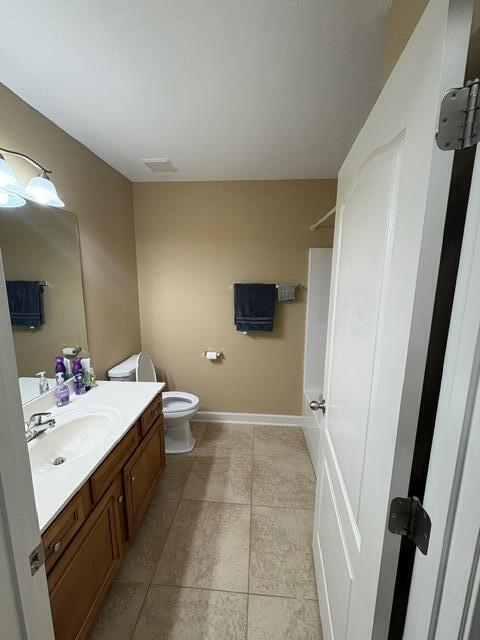 3157 Forrest Avenue Crestview, FL 32539 - Photo 7 of 22 a bathroom with a sink a toilet and shower