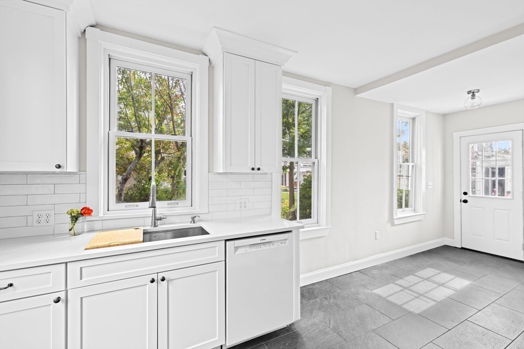92 Hampton Circle Hull, MA 02045 - Photo 11 of 28 a kitchen with a sink and a window