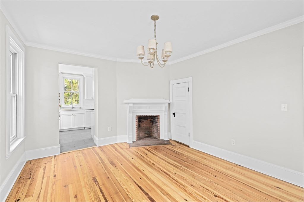 92 Hampton Circle Hull, MA 02045 - Photo 14 of 28 a bedroom with a bed and a fireplace