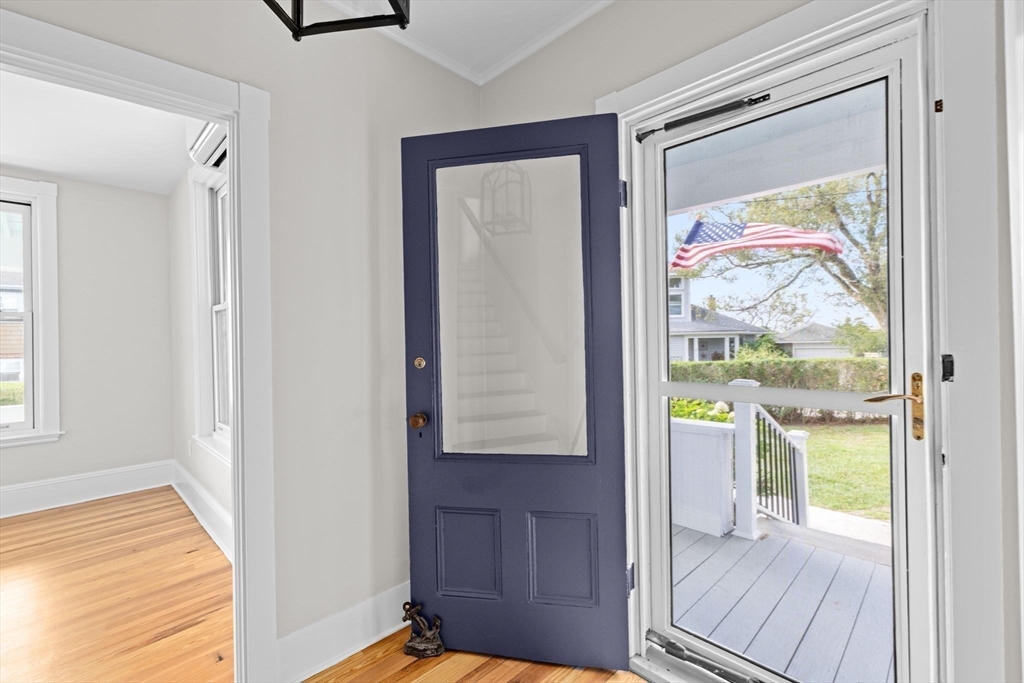 92 Hampton Circle Hull, MA 02045 - Photo 15 of 28 a view of a hallway with wooden floor and a bedroom