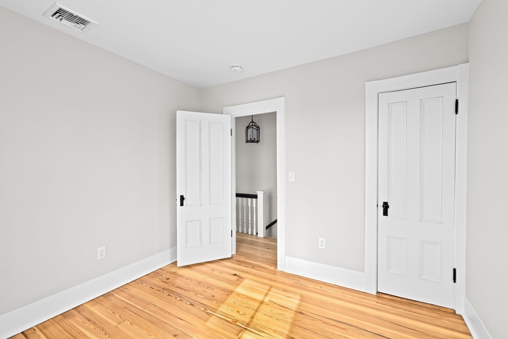 92 Hampton Circle Hull, MA 02045 - Photo 22 of 28 a view of a room with wooden floor and closet