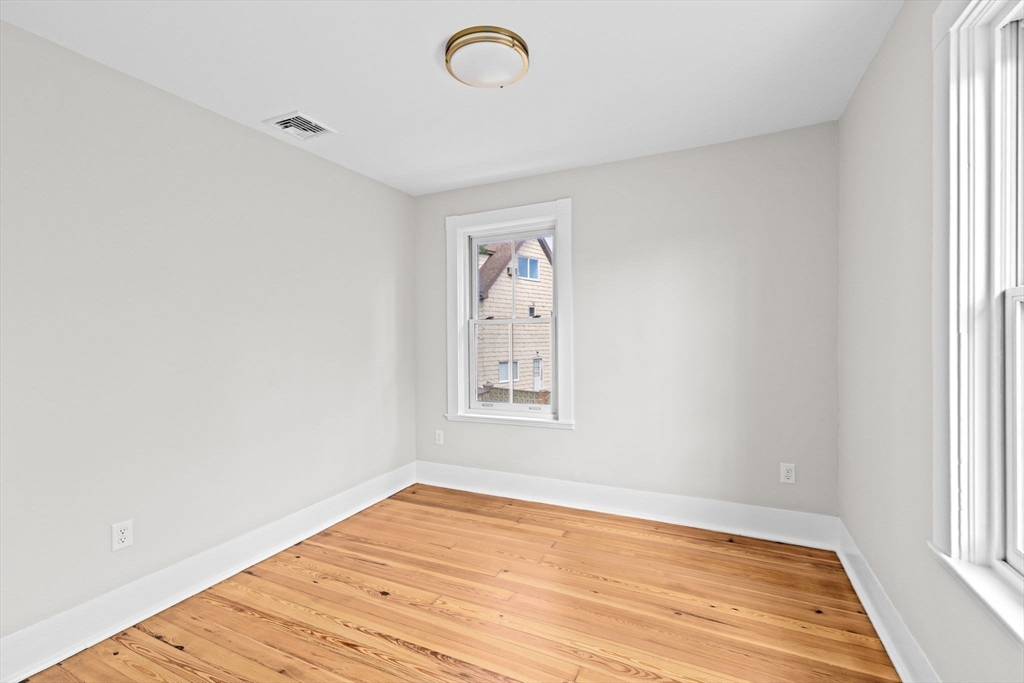 92 Hampton Circle Hull, MA 02045 - Photo 23 of 28 an empty room with a window